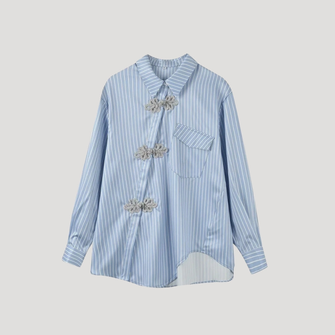 Striped blouse with floral appliqué closures