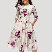 Women’s floral long sleeve midi wedding guest dress