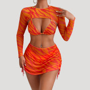 Bold three-piece bikini set with mesh cover-up