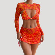 Bold three-piece bikini set with mesh cover-up